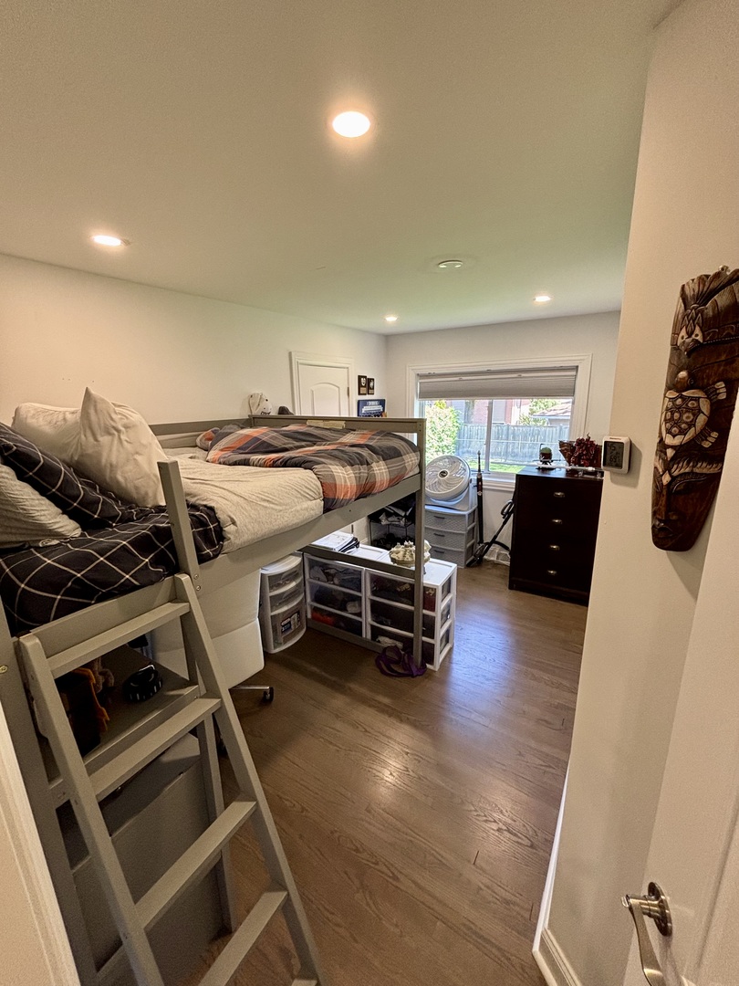 1237 Heatherfield Lane Glenview, IL 60025 - Photo 18 of 33 a bedroom with furniture and wooden floor