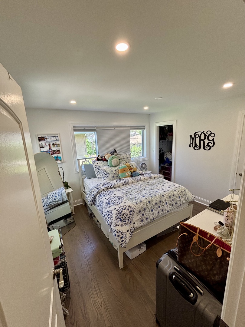 1237 Heatherfield Lane Glenview, IL 60025 - Photo 23 of 33 a bedroom with a bed and wooden floor