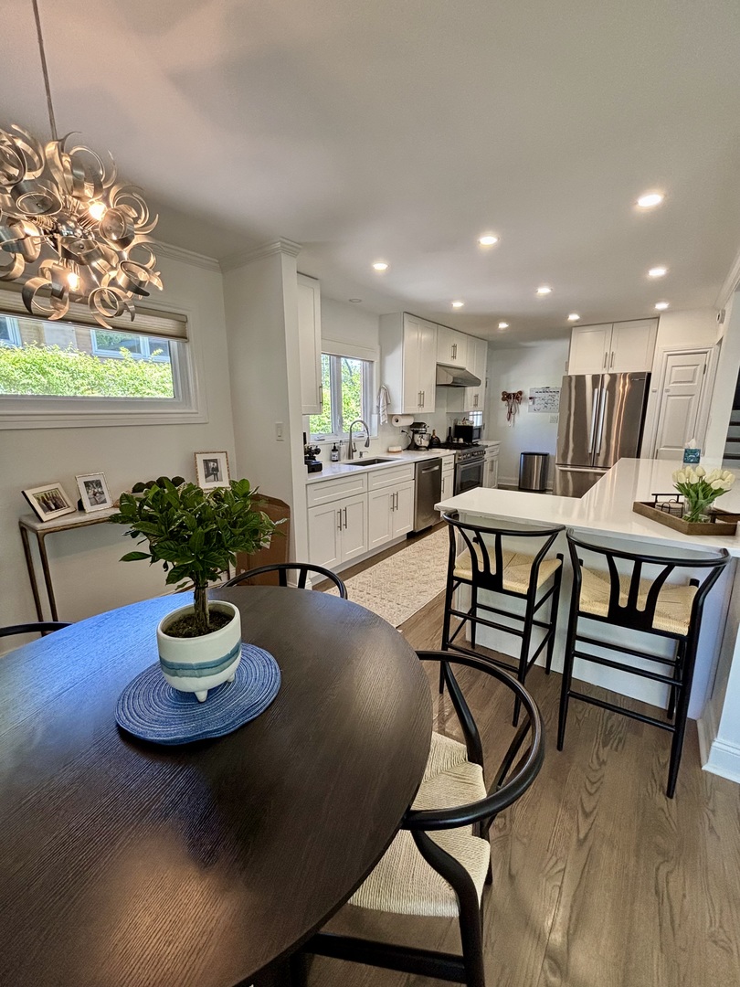 1237 Heatherfield Lane Glenview, IL 60025 - Photo 5 of 33 a kitchen with a dining table chairs and kitchen view