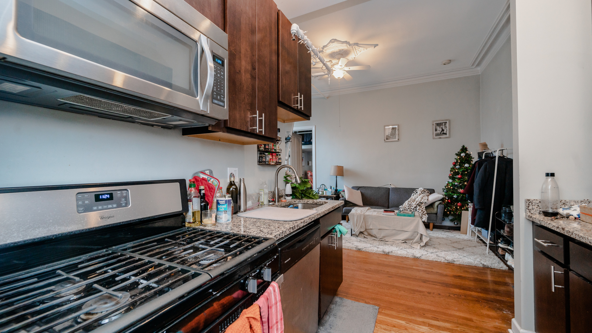 656 West Belden Avenue, Unit 202 Chicago, IL 60614 - Photo 7 of 14 a kitchen with a stove and a wooden floor