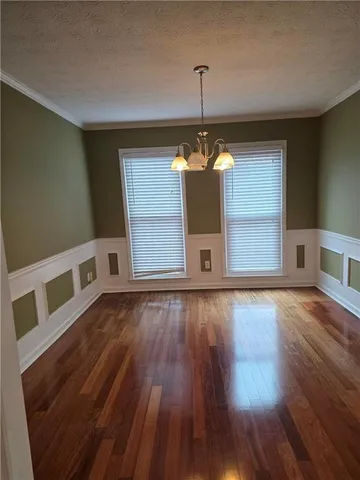 a view of a livingroom with wooden floor