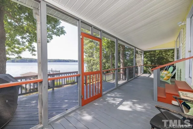 a view of a balcony with chairs
