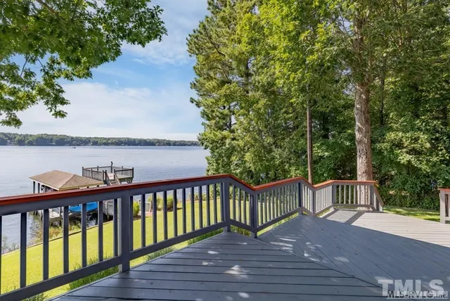 a view of a wooden deck and garden