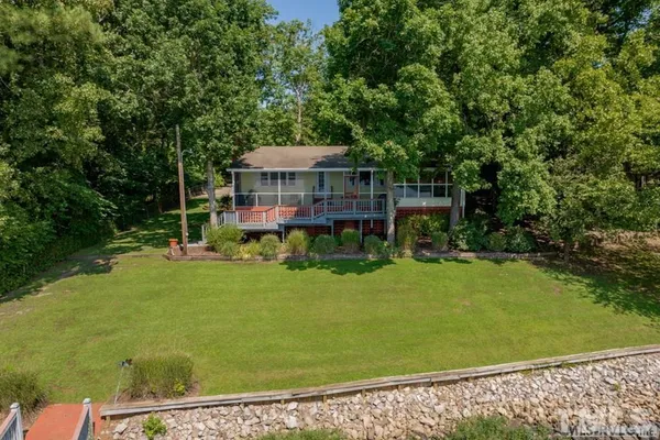 a view of a deck with chair and table