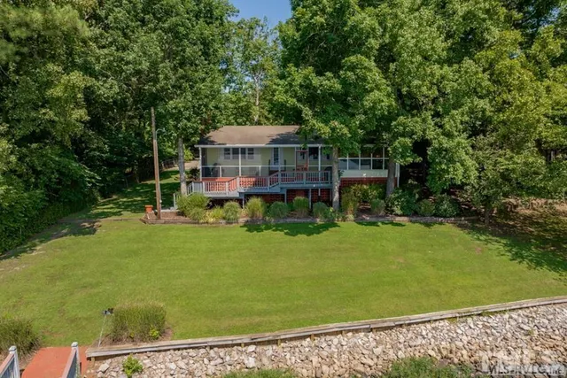 a view of a deck with chair and table