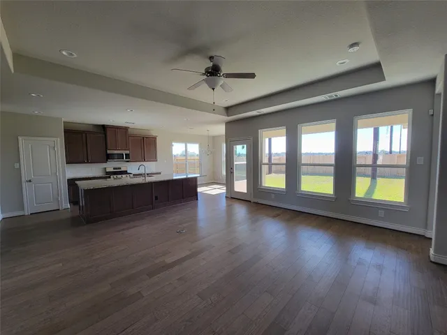 a view of kitchen and a wooden floor