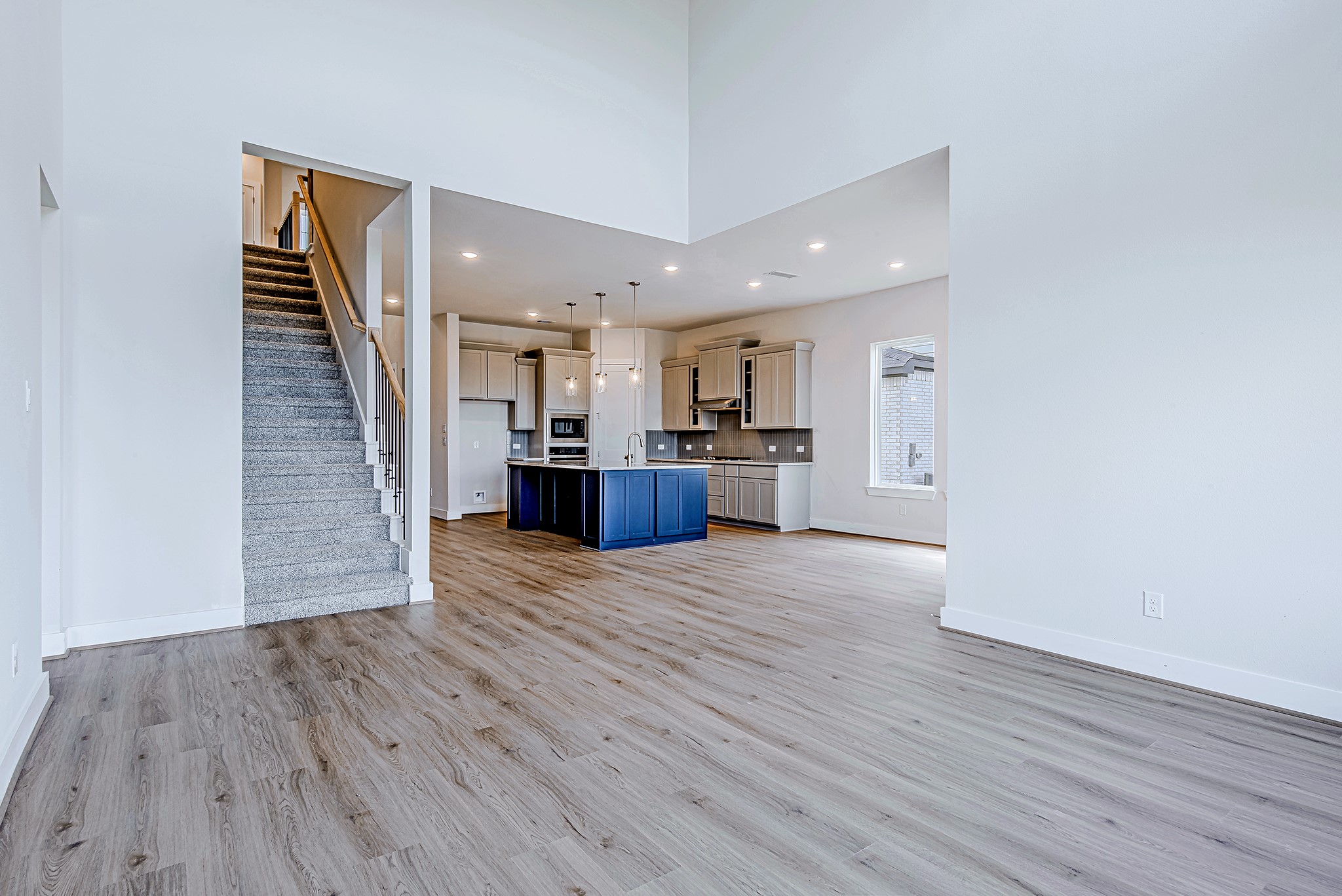 181 Peninsula Point Drive Montgomery, TX 77356 - Photo 15 of 44 The seamless flow between the living area and kitchen is ideal for entertaining, while the upgraded finishes and clean lines tie the space together beautifully.