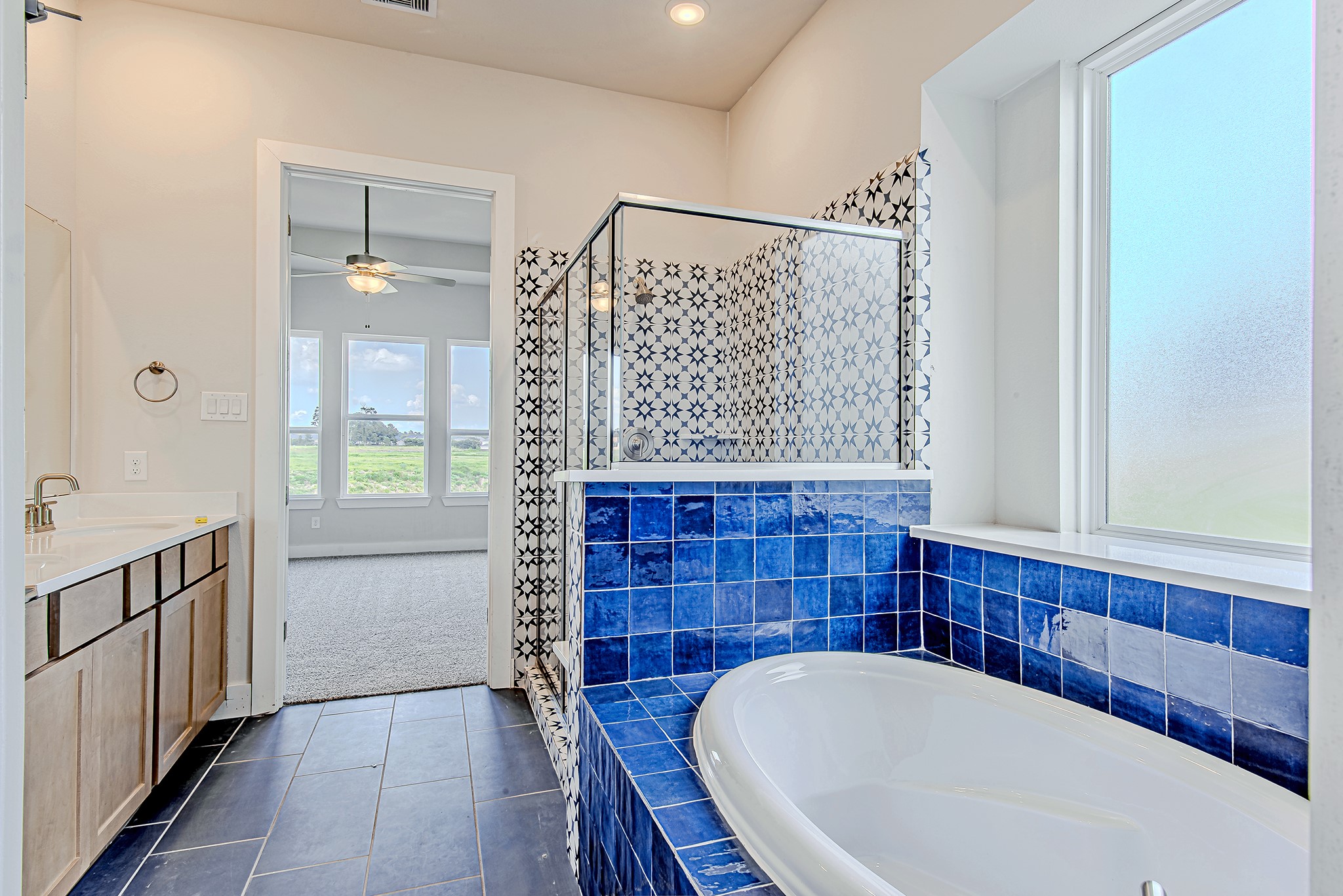 181 Peninsula Point Drive Montgomery, TX 77356 - Photo 21 of 44 This bath retreat captures natural light while offering privacy and style—a seamless blend of function and charm with scenic views just beyond the glass.