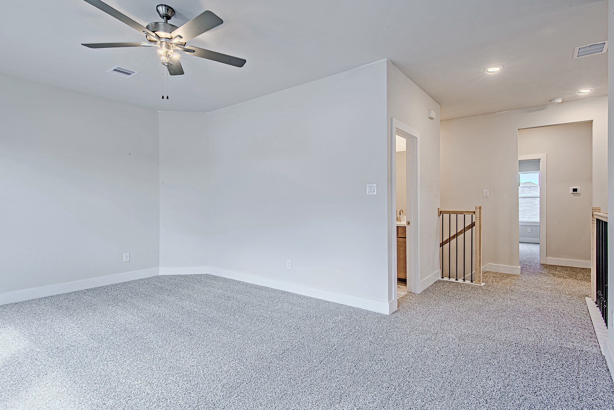 181 Peninsula Point Drive Montgomery, TX 77356 - Photo 25 of 44 The upstairs game room offers a flexible space for movie nights, homework stations, or weekend sleepovers—with easy access to a full bathroom and secondary bedrooms nearby.
