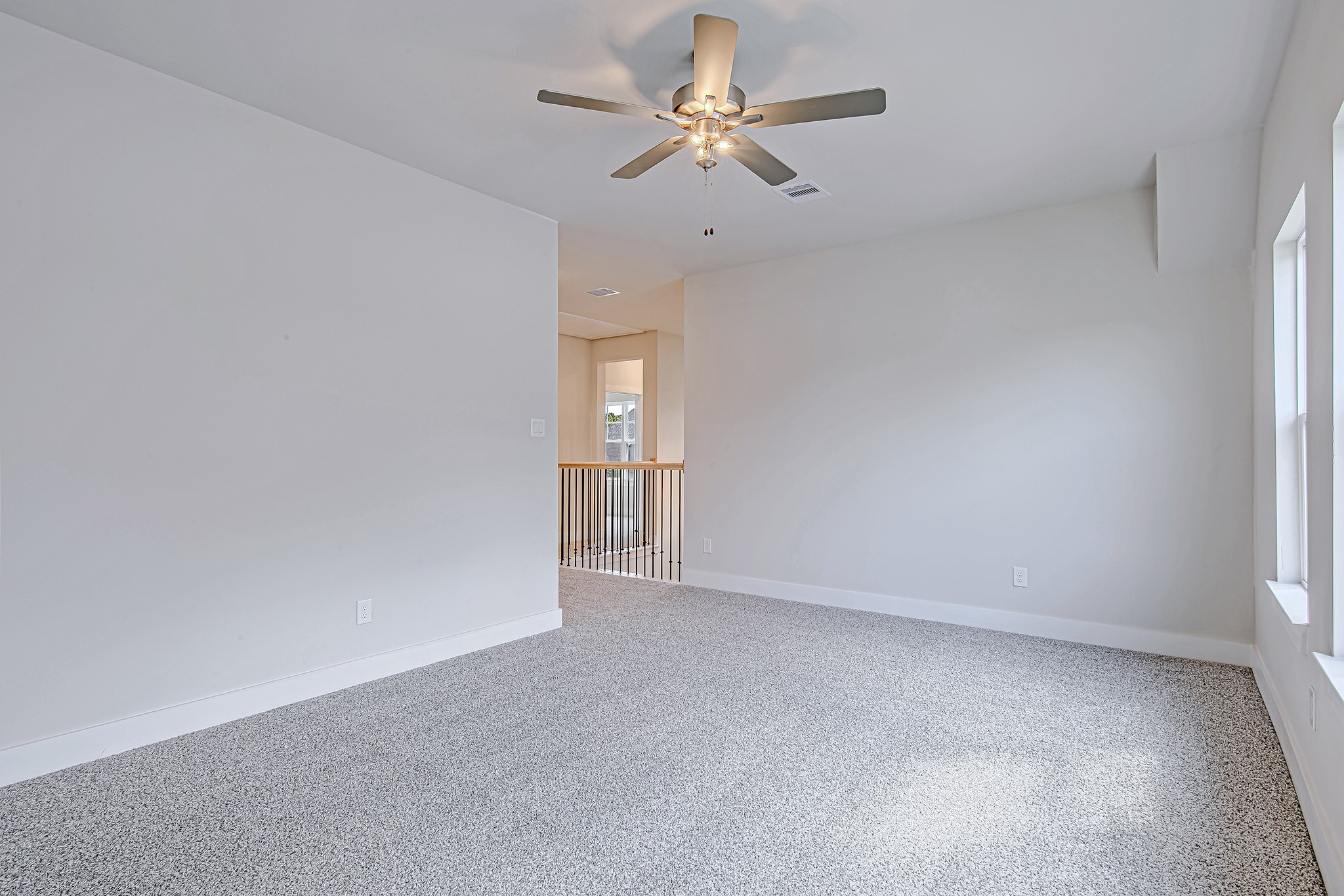 181 Peninsula Point Drive Montgomery, TX 77356 - Photo 26 of 44 Another view of the room shows its generous size and how it connects seamlessly to the rest of the second floor, making it the perfect hub for upstairs living.