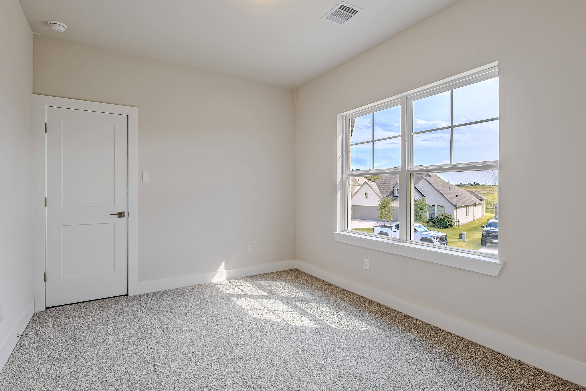 181 Peninsula Point Drive Montgomery, TX 77356 - Photo 27 of 44 This secondary bedroom is bright, inviting, and versatile