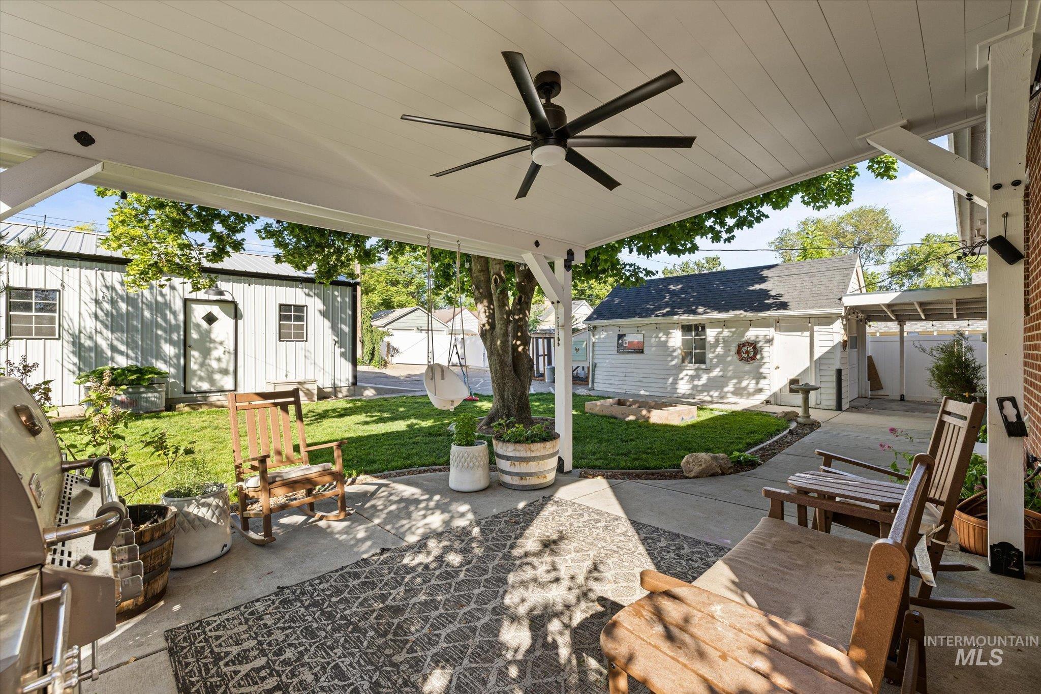 1008 Fillmore Street Caldwell, ID 83605 - Photo 13 of 50 View of patio / terrace featuring an outdoor structure, area for grilling, and a ceiling fan