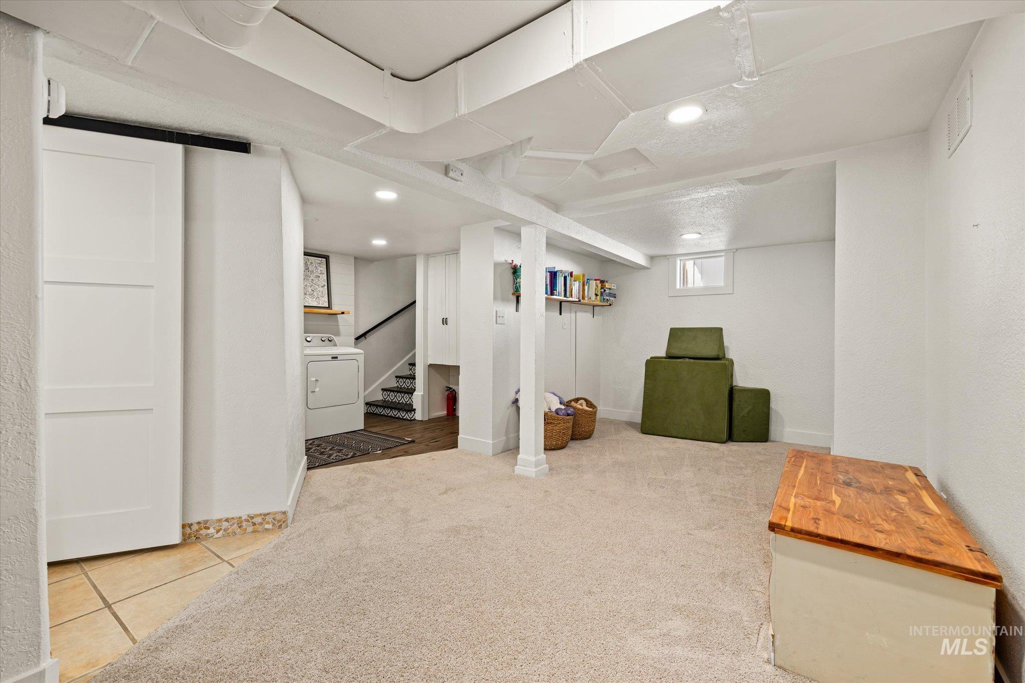 1008 Fillmore Street Caldwell, ID 83605 - Photo 17 of 50 Basement with washer / clothes dryer, stairs, carpet flooring, recessed lighting, and tile patterned floors