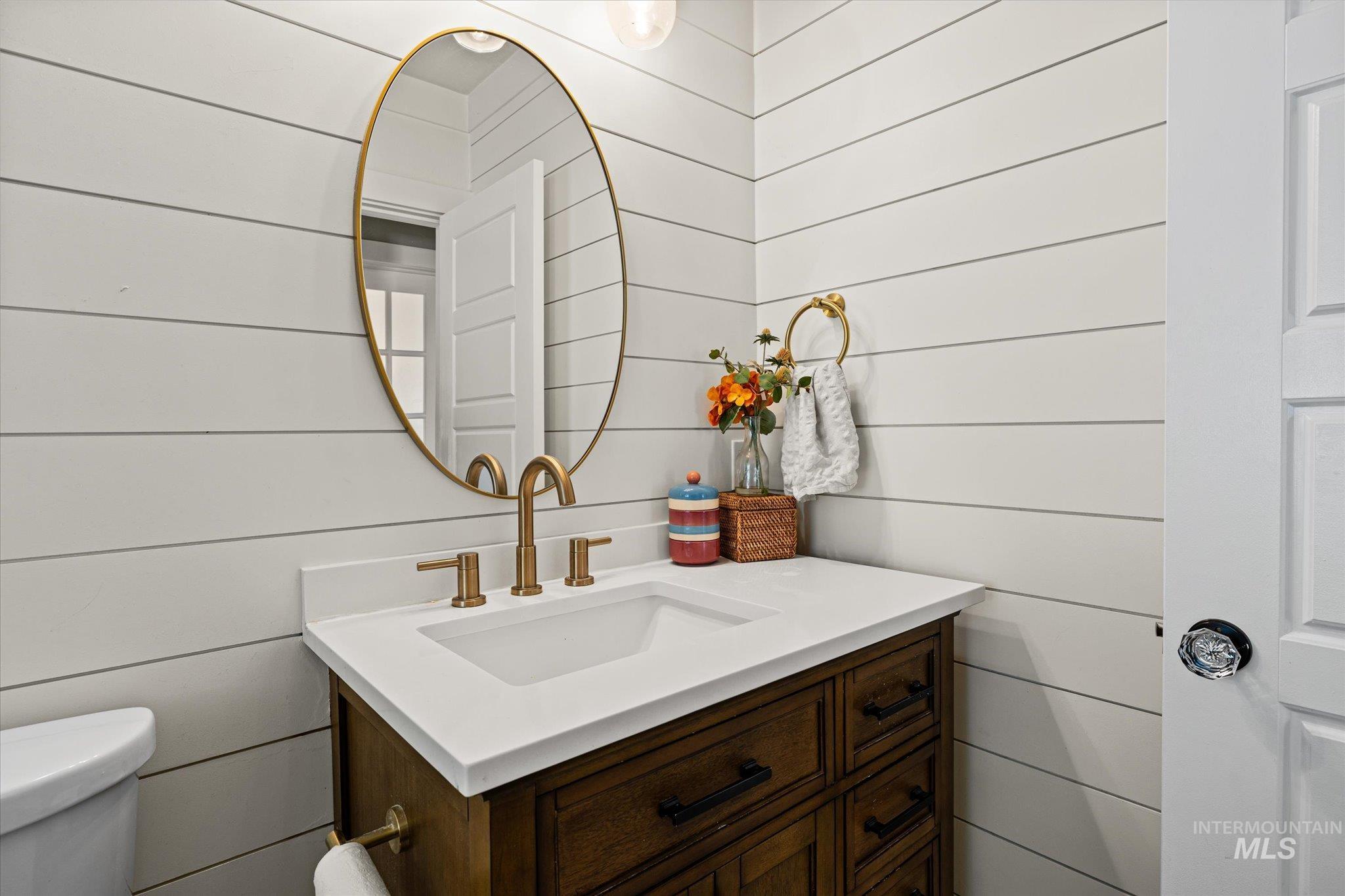 1008 Fillmore Street Caldwell, ID 83605 - Photo 33 of 50 Bathroom with vanity and wood walls