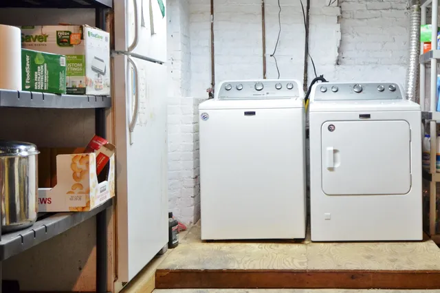 a utility room with dryer and washer