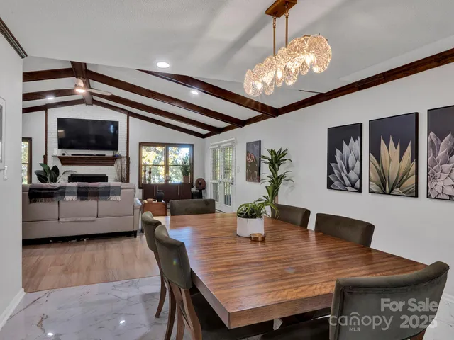 a dining room with furniture and window