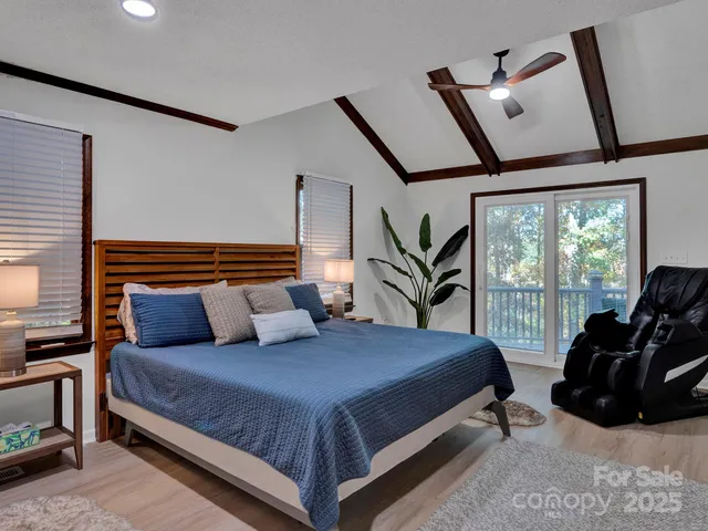 a bedroom with a bed a window and dresser