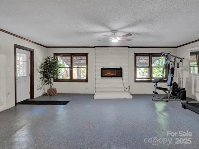 a living room with furniture window and a fireplace