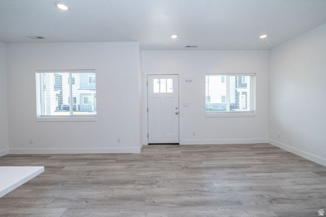 46 West 460 Smithfield, UT 84335 - Photo 2 of 31 Entryway featuring a white paneled door with glass inserts, flanked by two windows with blinds