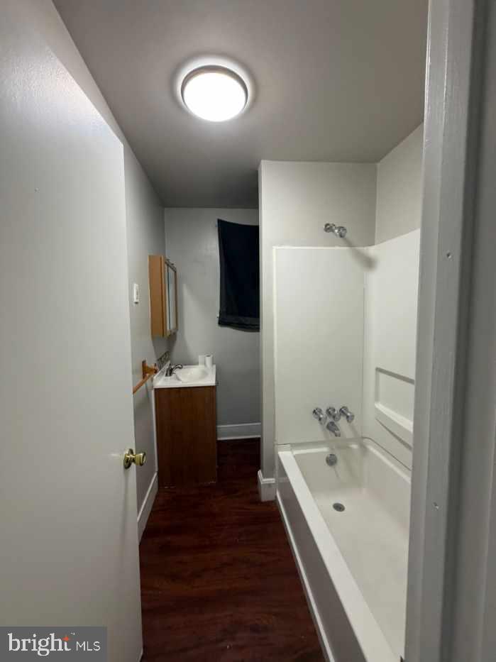 135 9th Street Brookhaven, PA 19015 - Photo 7 of 9 a bathroom with a tub sink and mirror