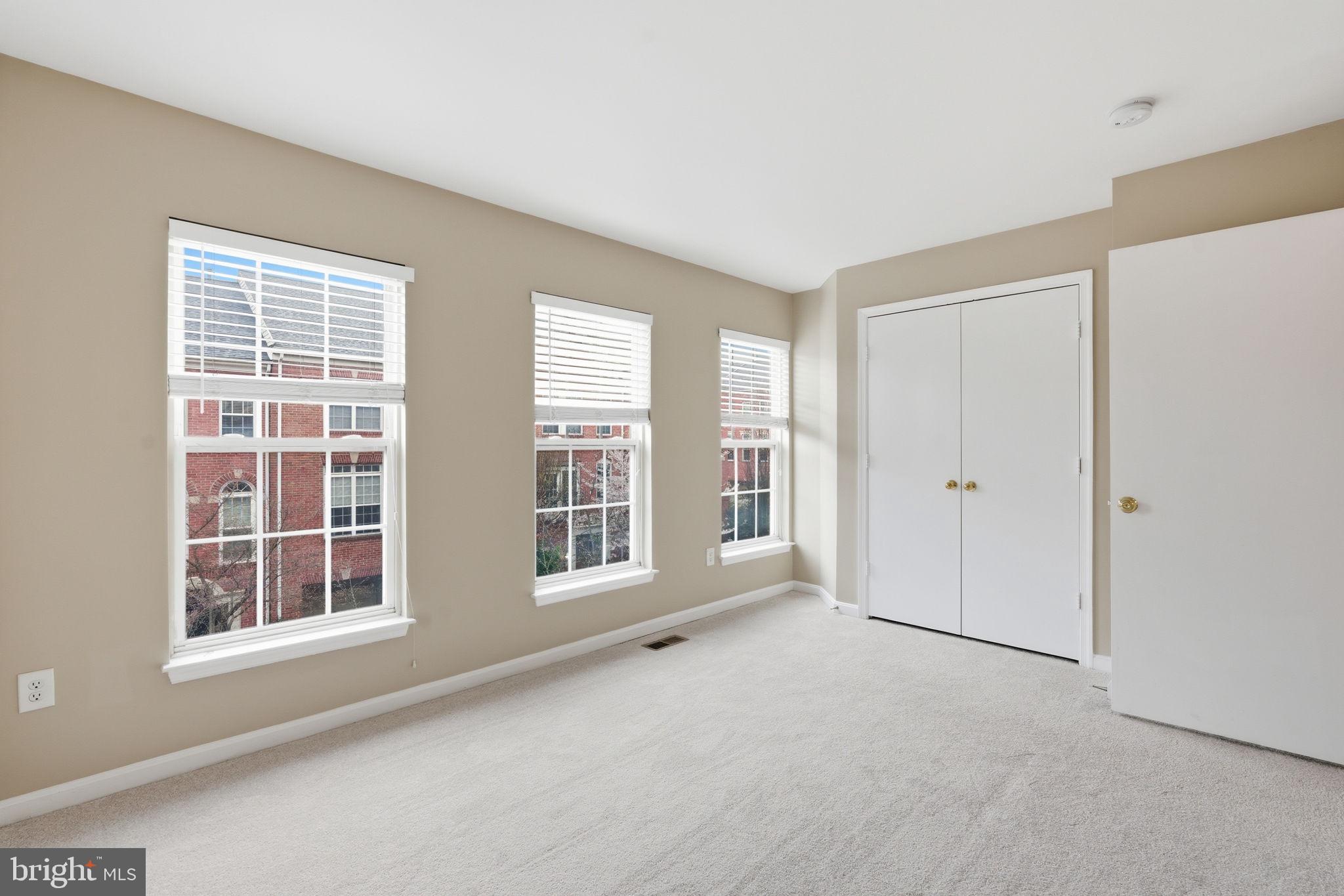 8074 Sebon Drive Vienna, VA 22180 - Photo 16 of 22 an empty room with windows