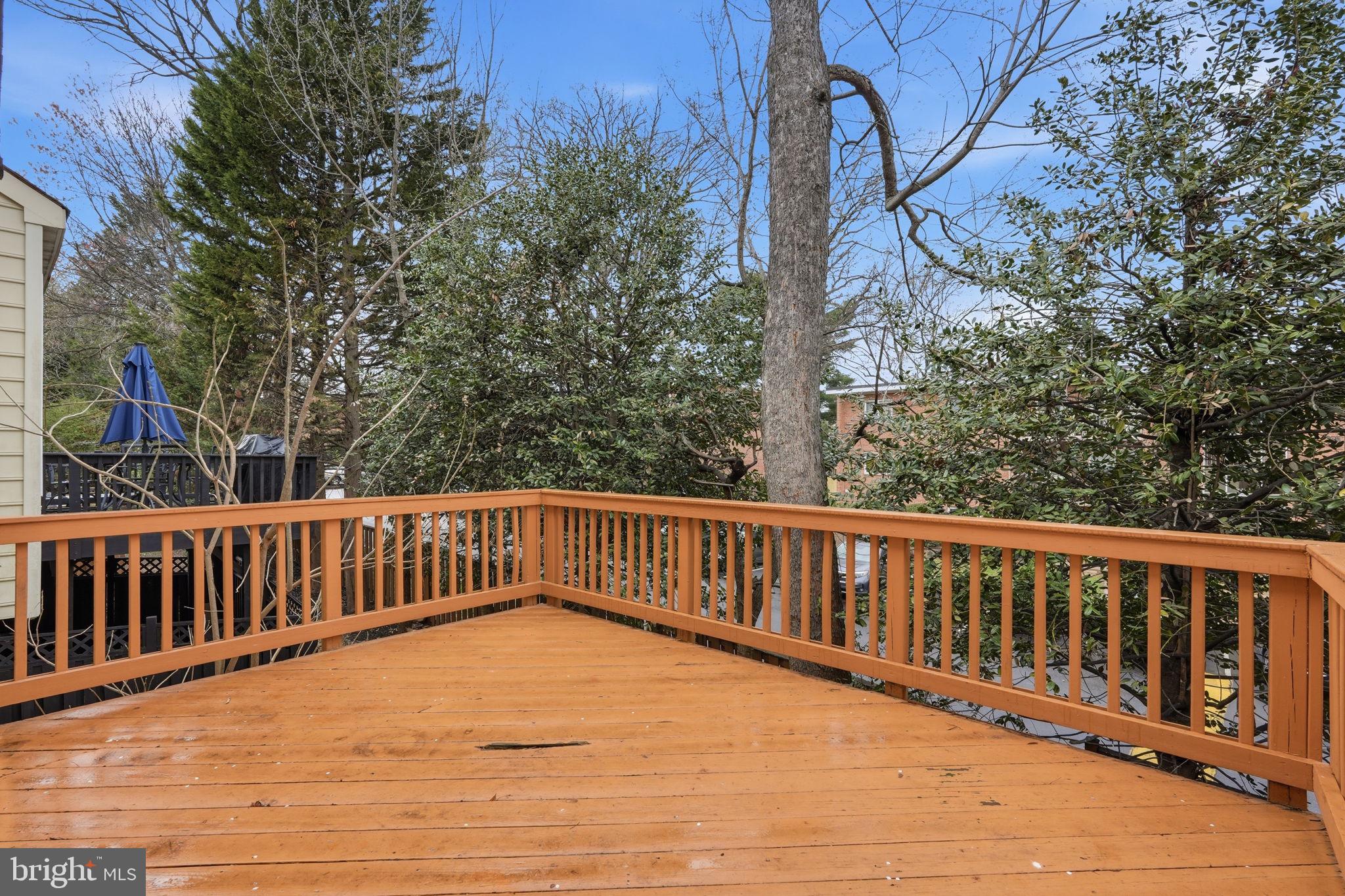8074 Sebon Drive Vienna, VA 22180 - Photo 19 of 22 a view of balcony with wooden floor and fence