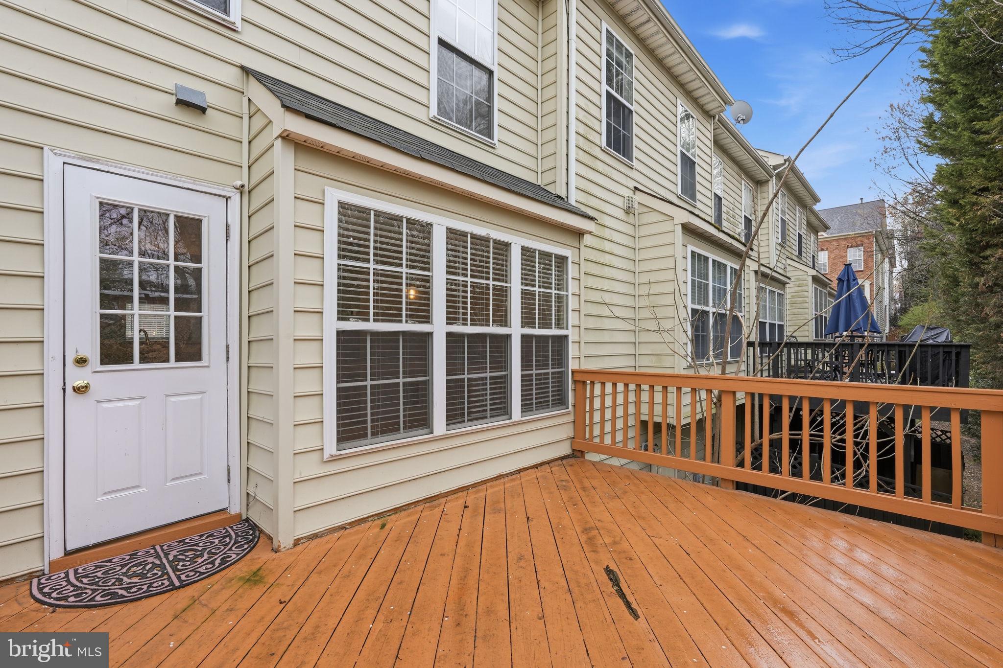 8074 Sebon Drive Vienna, VA 22180 - Photo 20 of 22 a view of wooden house with large windows