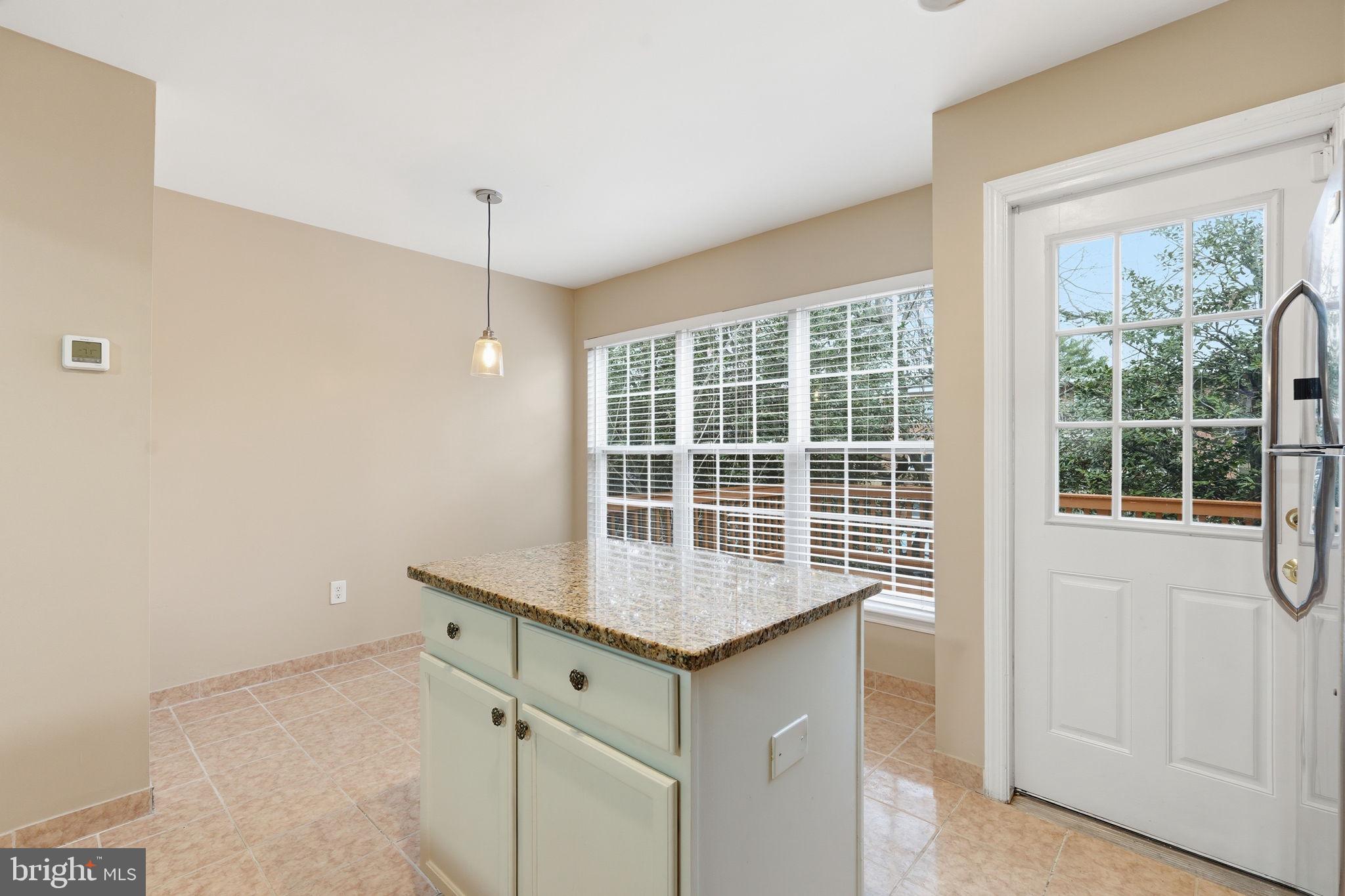 8074 Sebon Drive Vienna, VA 22180 - Photo 6 of 22 a room with a table and window