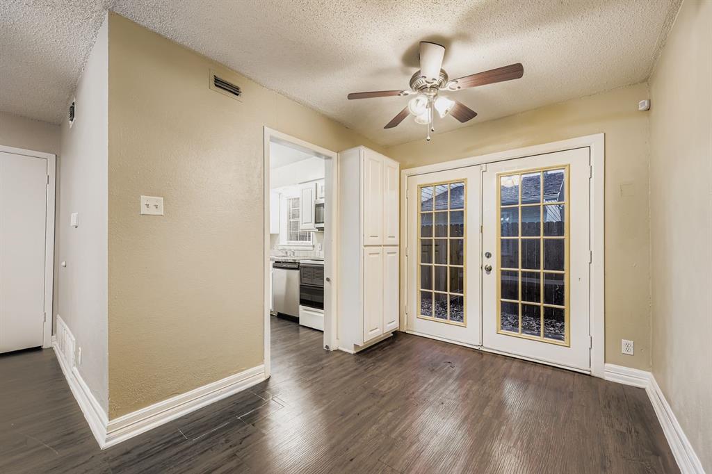 214 Austin Street Grapevine, TX 76051 - Photo 8 of 28 a view of empty room with wooden floor and fan