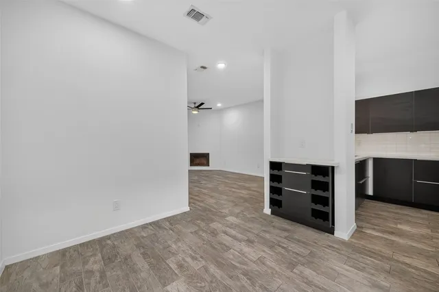a view of a bedroom with furniture and flat screen tv