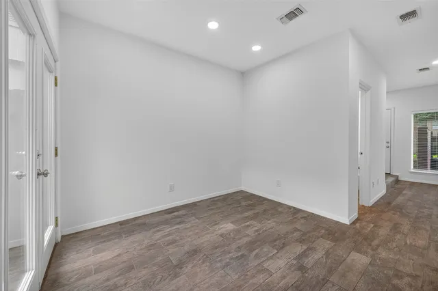 a kitchen with stainless steel appliances a refrigerator and cabinets