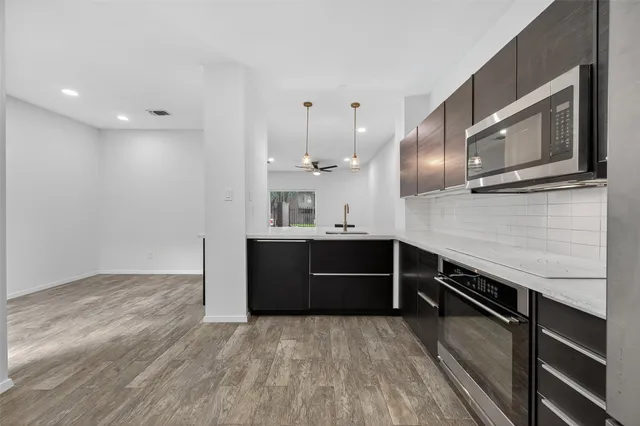 a kitchen with a sink and a refrigerator