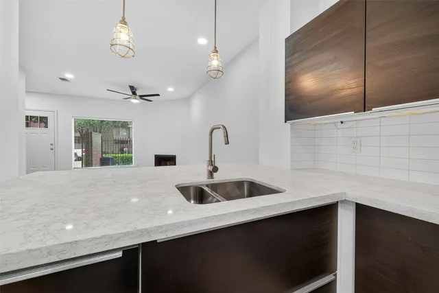 a view of a room with wooden floor and entryway