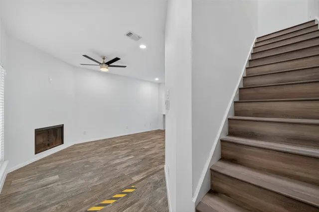 a view of an empty room with stairs