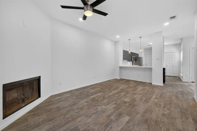 a view of a kitchen with a sink and a stove top oven
