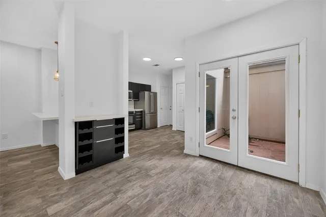 a view of a room with wooden floor and closet