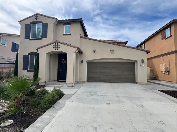a front view of a house with yard