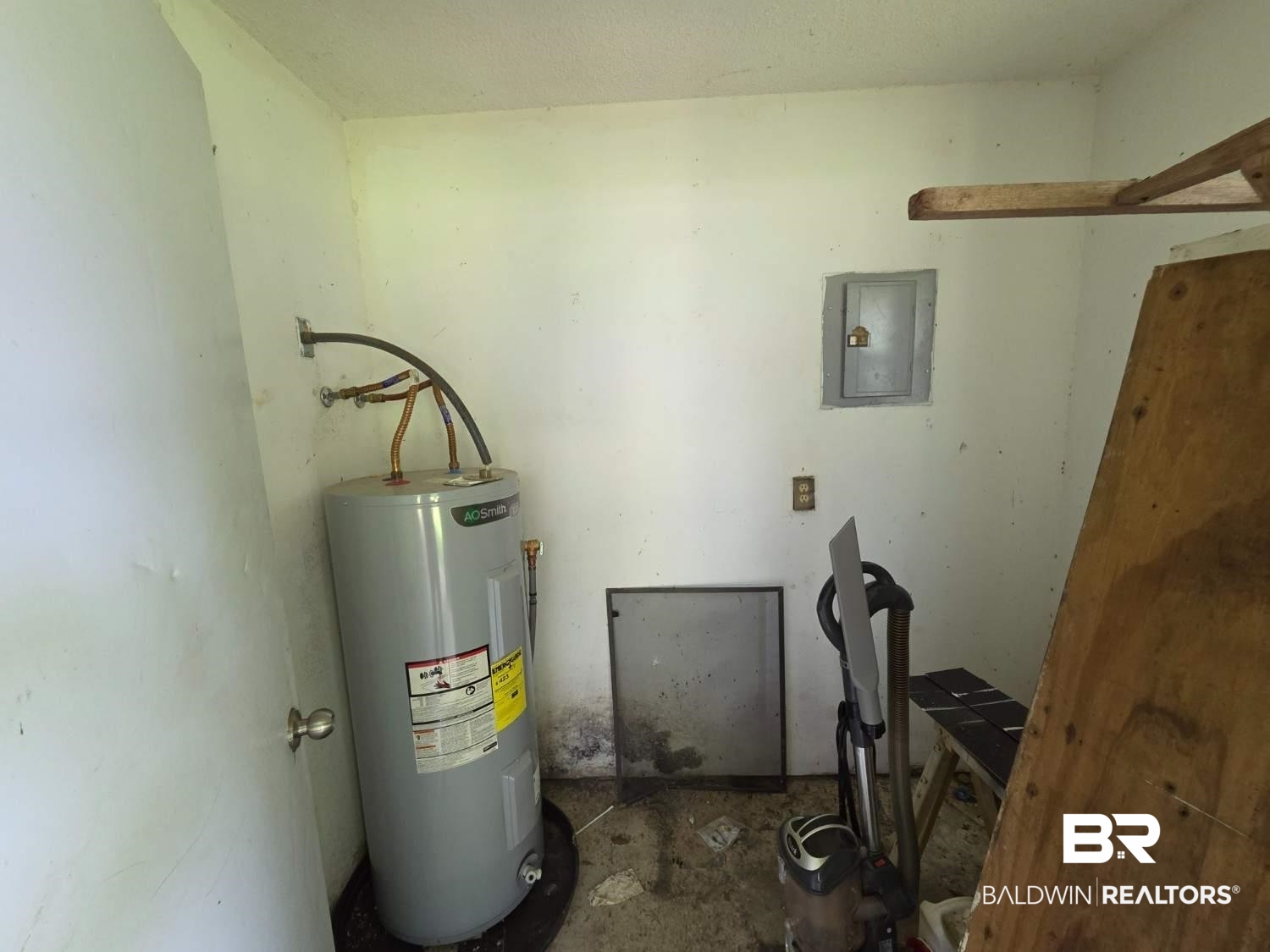 106 West 16th Street Bay Minette, AL 36507 - Photo 6 of 19 Utility room featuring water heater and electric panel