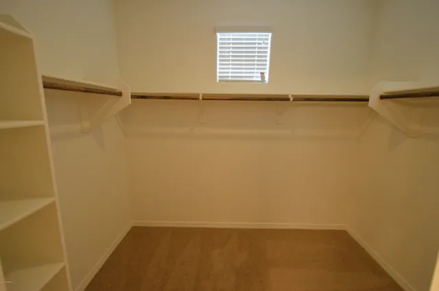 a view of an empty walk in closet