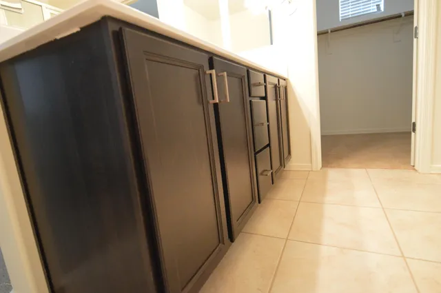 a view of staircase with railing and a window
