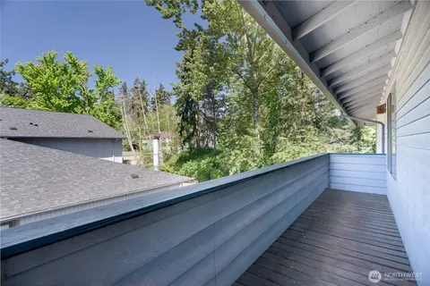 a view of balcony with wooden floor