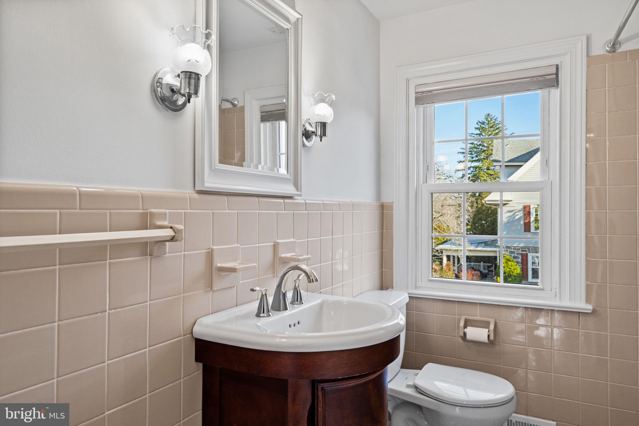 727 East Manoa Road Havertown, PA 19083 - Photo 47 of 68 a bathroom with a toilet a sink and mirror