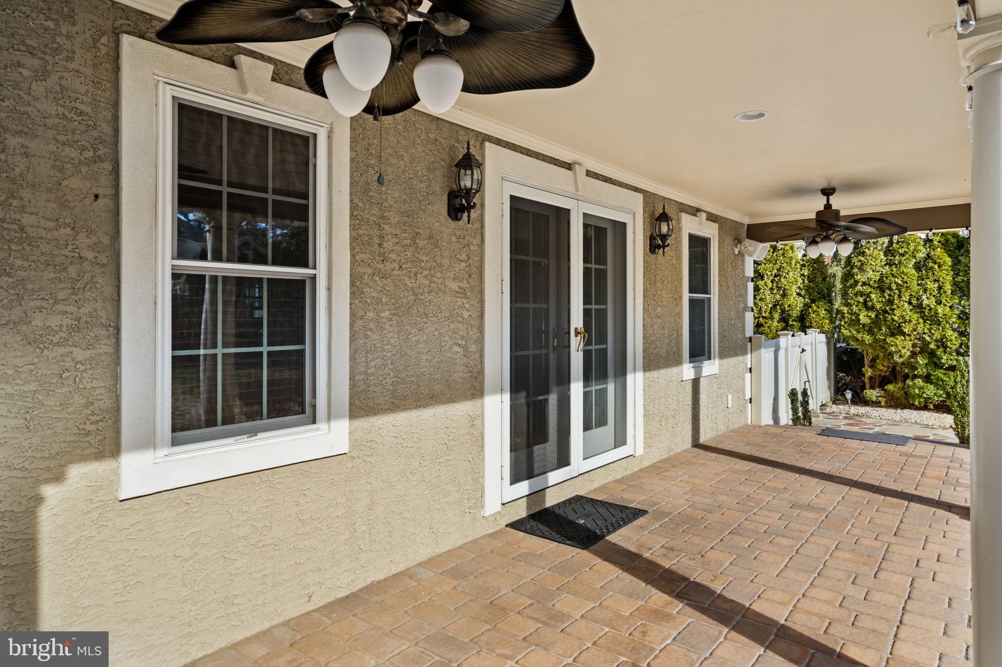 727 East Manoa Road Havertown, PA 19083 - Photo 59 of 68 a view of a porch with a floor to ceiling window and floor to ceiling window