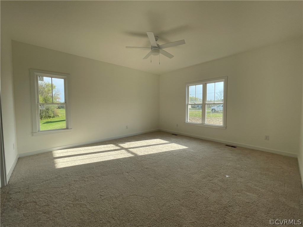 3324 Three Chopt Road Gum Spring, VA 23065 - Photo 21 of 43 an empty room with a window and a ceiling fan