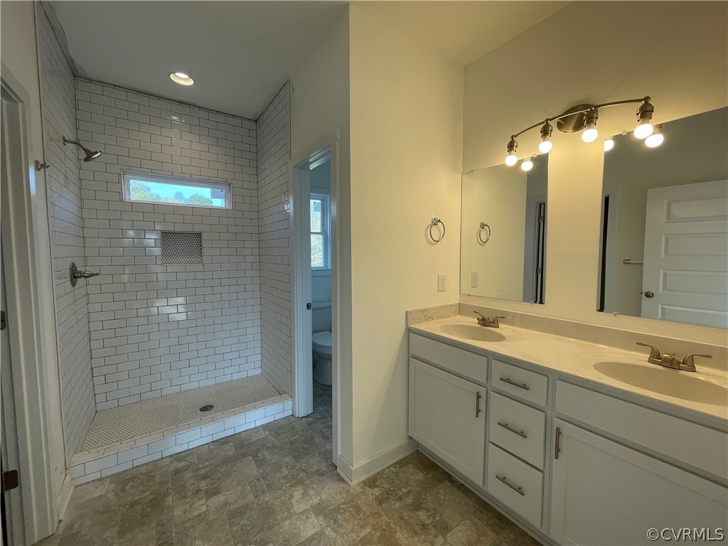 3324 Three Chopt Road Gum Spring, VA 23065 - Photo 23 of 43 a bathroom with a shower sink and mirror