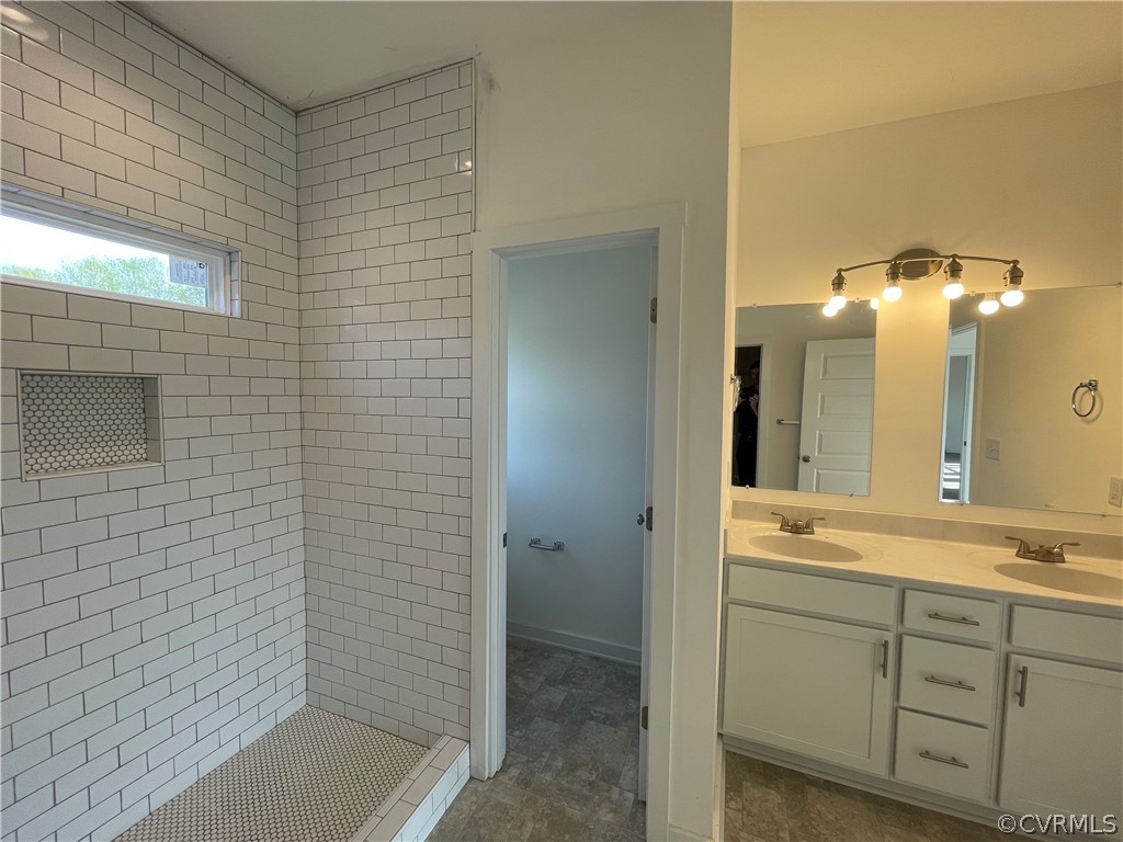 3324 Three Chopt Road Gum Spring, VA 23065 - Photo 25 of 43 a bathroom with a granite countertop sink a mirror and a shower