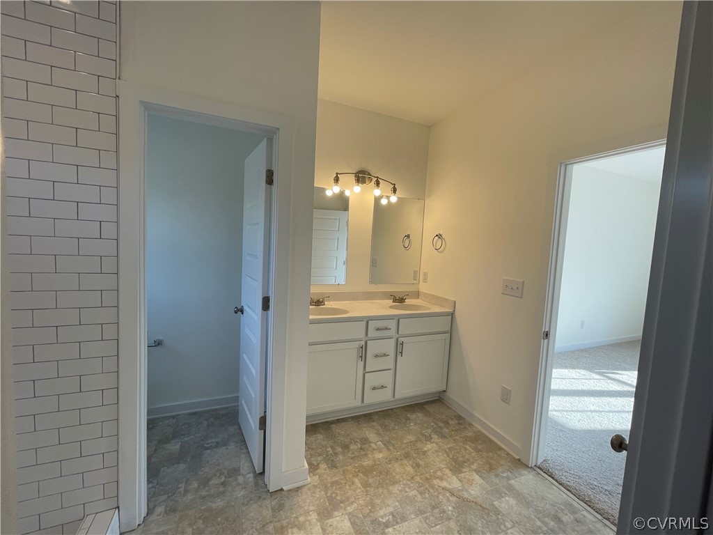 3324 Three Chopt Road Gum Spring, VA 23065 - Photo 26 of 43 a bathroom with a sink and a mirror