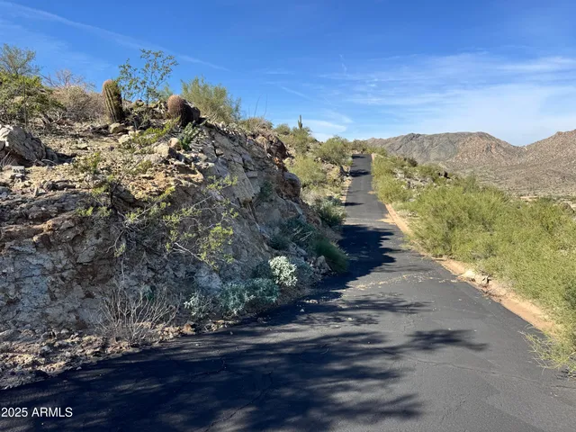 a view of a road with an ocean view
