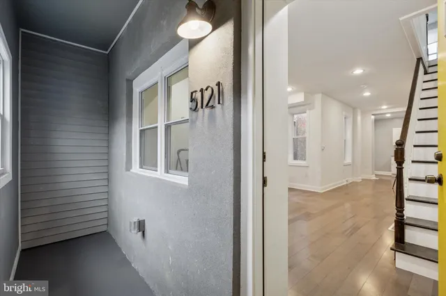 a view of a hallway with windows