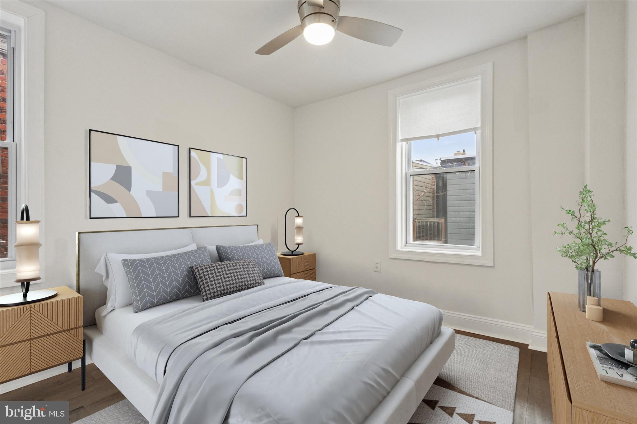 5121 Hadfield Street Philadelphia, PA 19143 - Photo 11 of 19 a bedroom with a large bed and a chandelier